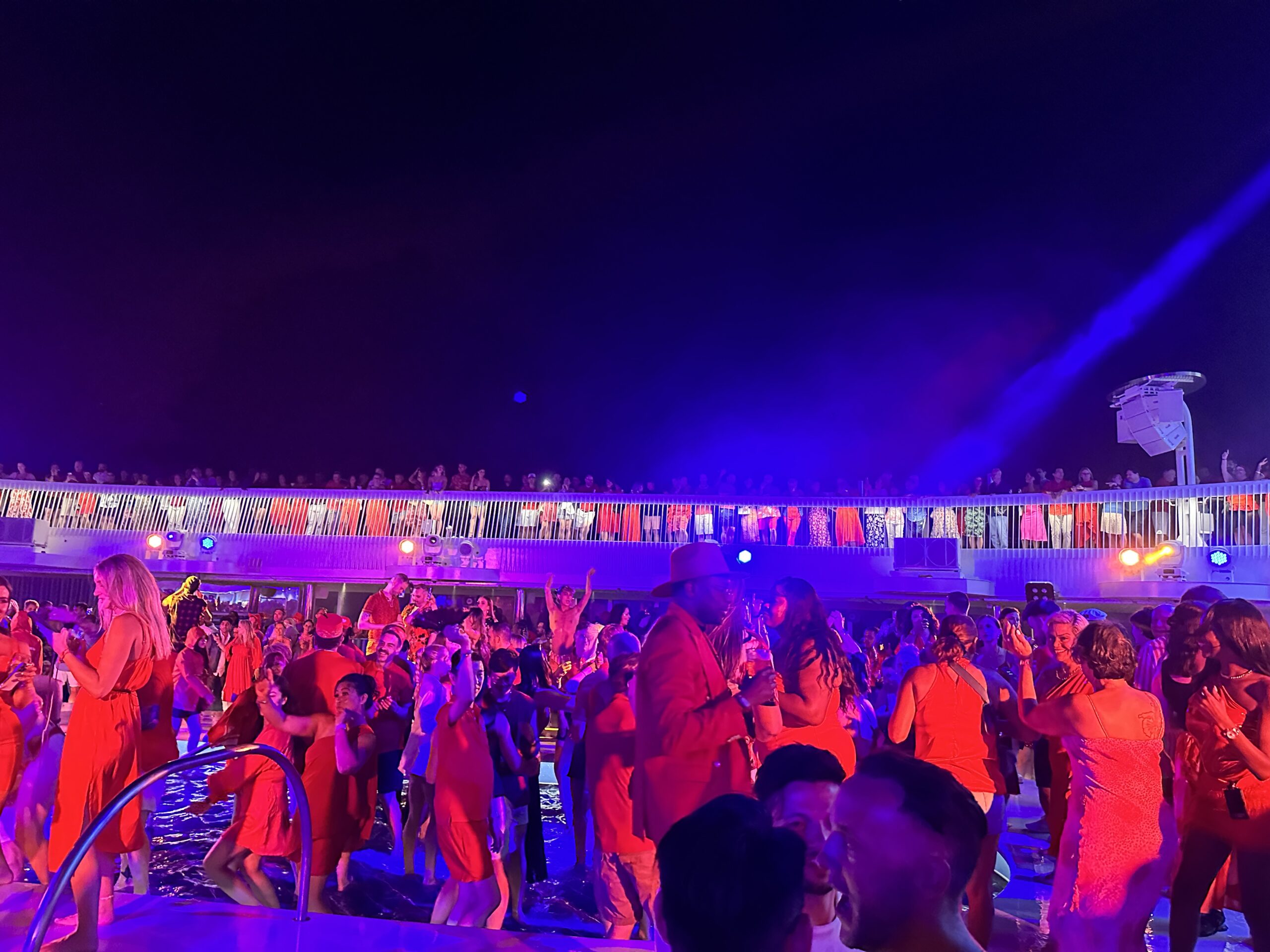 Virgin Voyages Scarlet Night pool party atmosphere onboard