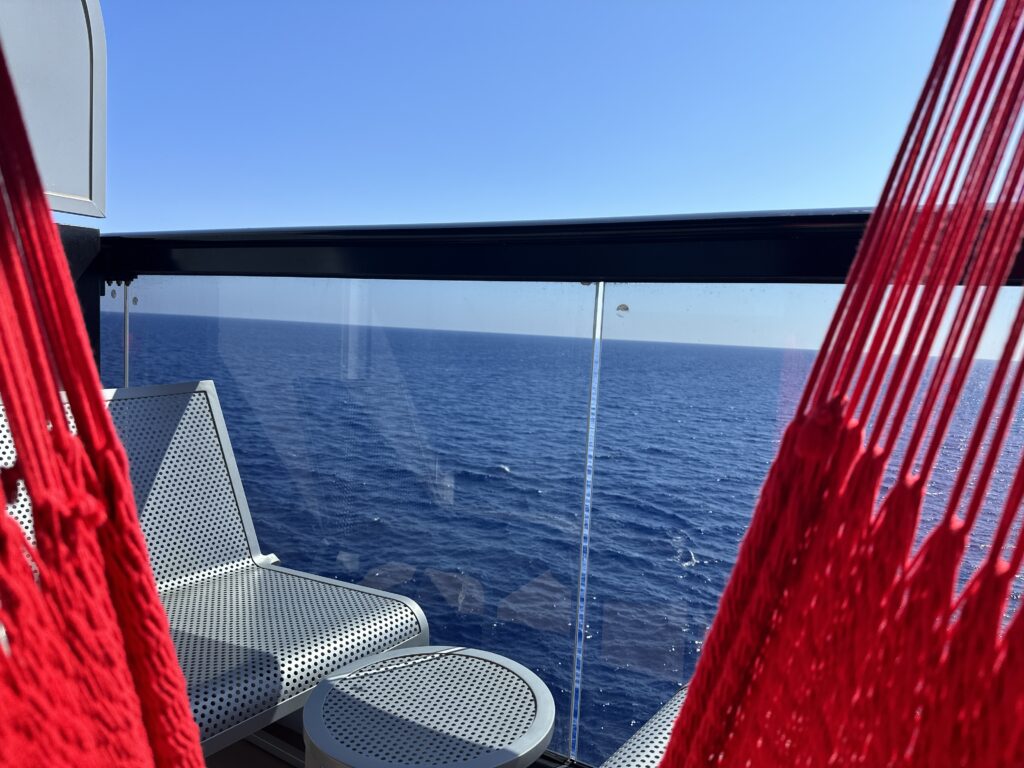Virgin Voyages Sea Terrace balcony overlooking the ocean on a sea day