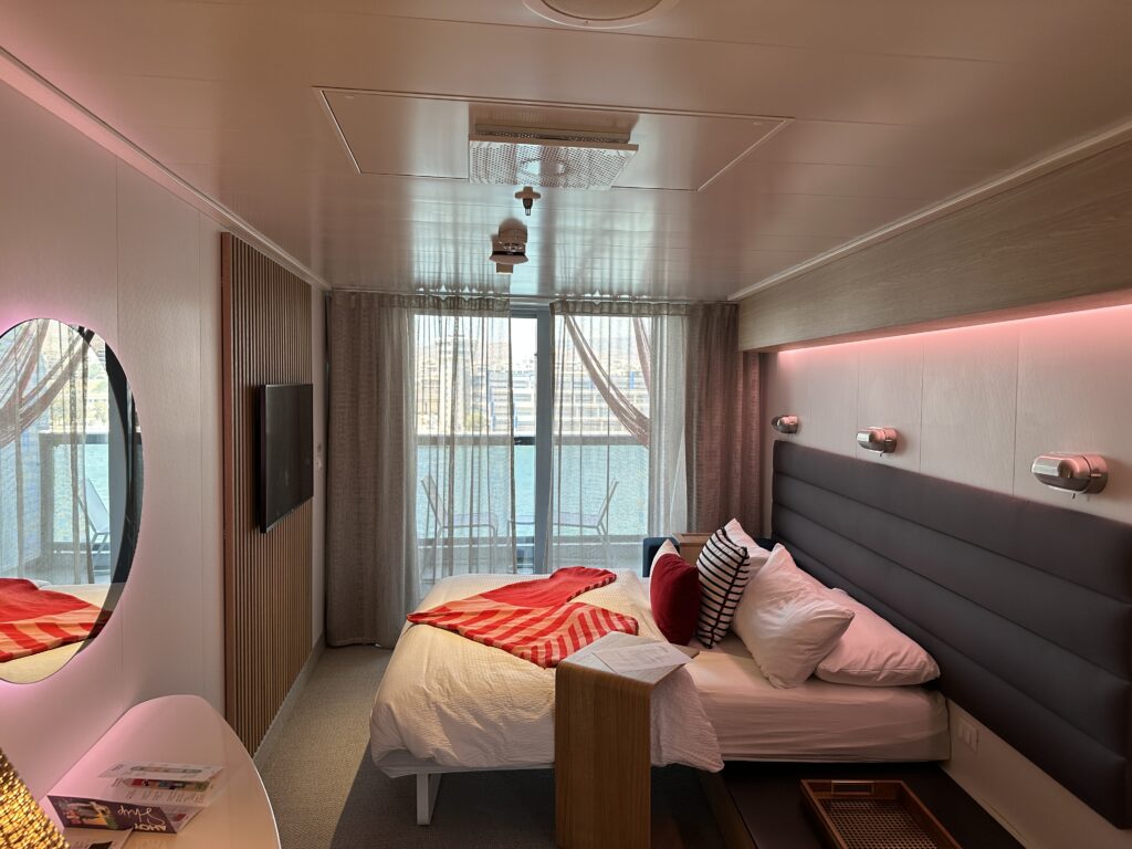 Virgin Voyages Sea Terrace cabin with private balcony and ocean view