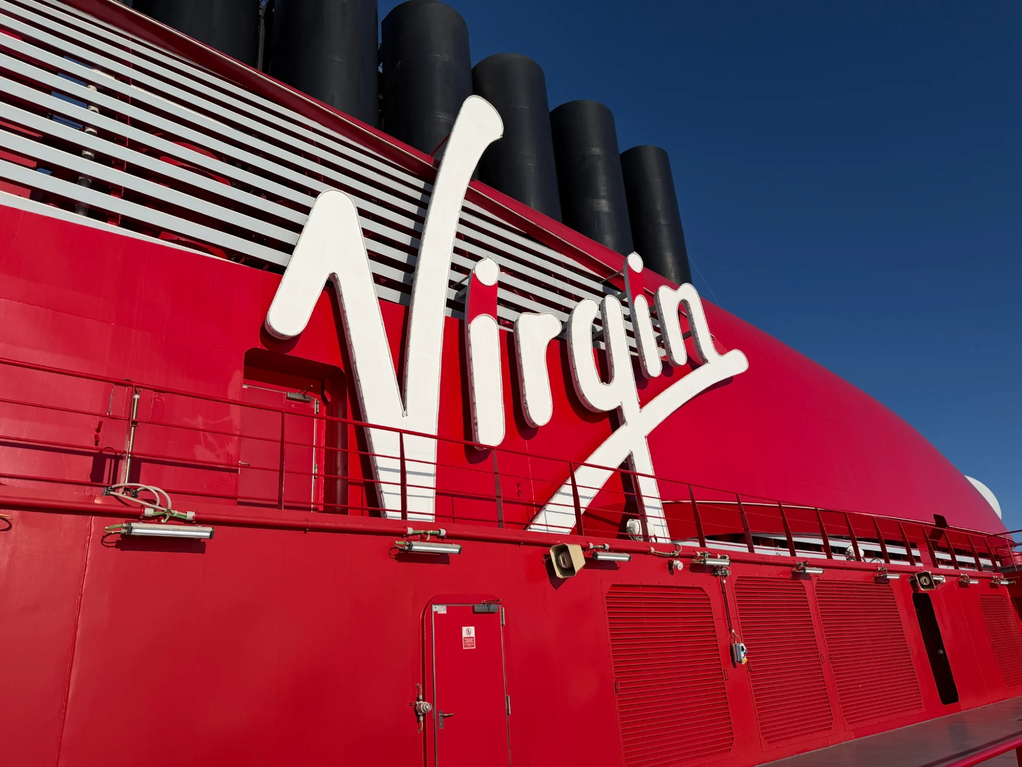 Virgin Voyages red funnel on Brilliant Lady near Prince Rupert